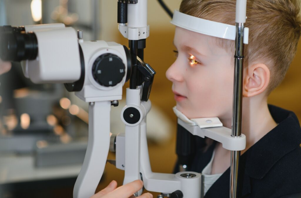 Young child getting a slit lamp exam done during an eye exam