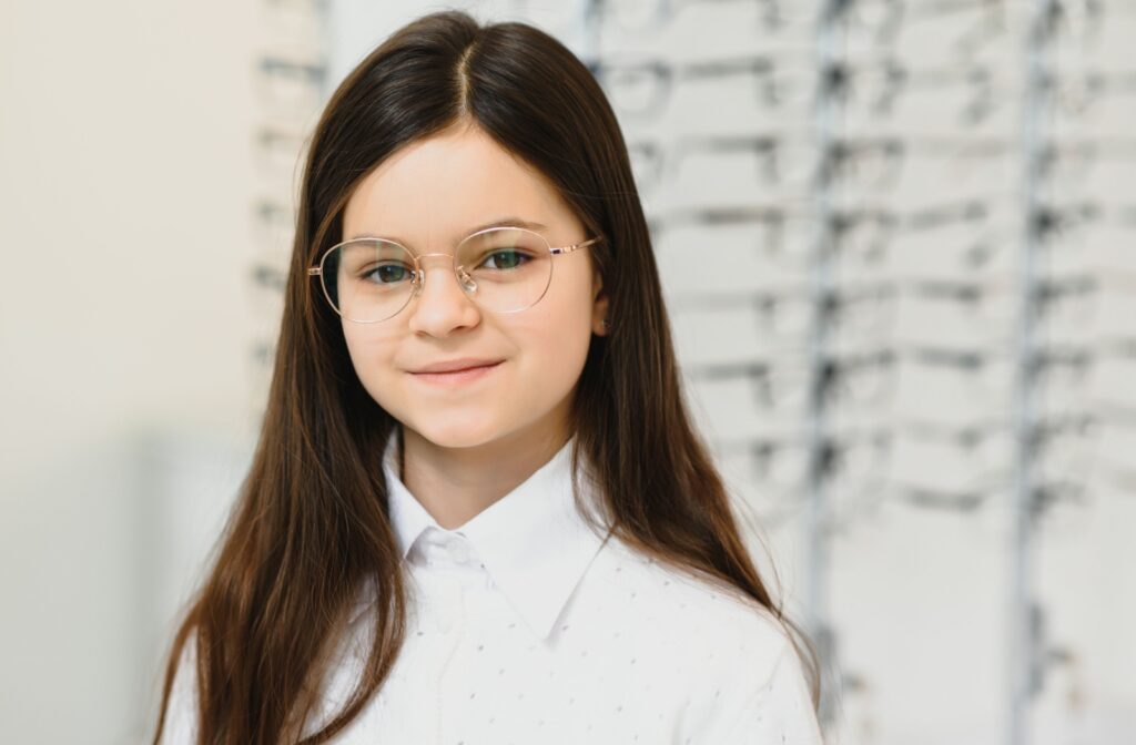 A child wearing glasses they picked out at the eye doctors